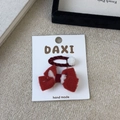 Red velvet bow and white pom pom hair clips set on a handmade white display card - Red Bowknot Pom Pom Style