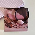 Pink oval resin bead hair tie with brown elastic band on a vintage card background - Pink