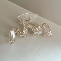 Funkelnde wellenförmige große Haarklammer aus Acryl mit einer goldenen Metallfeder - Champagner