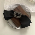Elegant black satin bow hair clip with crystal rectangle buckle on walnut wood decor - Spring Clips / Black