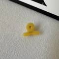 Top view of mini yellow acetate hair claw clip with SUNSHINE Handmade engraving - Yellow
