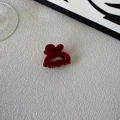 Glossy red heart-shaped hair claw clip made of polished resin on a white background - Heart Style / Red