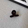 Detail of a dark tortoiseshell cellulose acetate mini hair claw clip with handmade engraving - Dark Brown