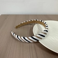 Detail of fabric headband showing diagonal stripes in black white and brown with non-slip lining - White Multi-Colored Stripes