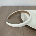 Detailed close-up of textured white woven fabric headband with non-slip suede lining - White Waffle