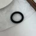 Matte black spiral hair tie with durable elastic phone cord design for women - Black