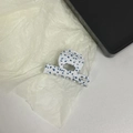 Detail of white acetate hair claw with blue dots and gold Barrette la France logo - Blue Polka Dots
