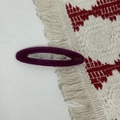 Detailed view of a purple oval acetate hair clip with gold Barrette La France lettering - Dark Purple