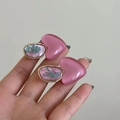 Detail view of heart-shaped pink resin and dried flower earrings with golden finish - Pink Heart Style / Pink