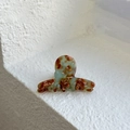 Detail of green tortoiseshell acetate hair claw clip with golden France Handmade logo - Mint Green Brown Gradient