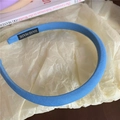 Simple blue fabric sponge headband for girls with a handmade quality label detail - Blue