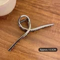 Detailed view of a 13.5cm large silver metal hair claw clip with a polished finish - Gun Black