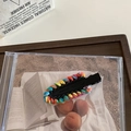 Rainbow woven chain hair clip with colorful knit texture on a black duckbill clip - Black