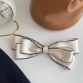 Elegant beige bow hair clip with black edge trimming for women's hairstyle accessory - White