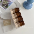 Elastic seamless hair tie set in earthy tones within a transparent storage box - Coffee Colors