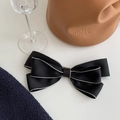 Elegant black double-layered bow hair clip with white trim and textured fabric finish - Black