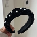 Detail of black velvet braided headband featuring elegant white faux pearls on thick fabric - Pearl Braided Style