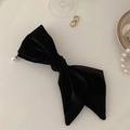 Elegant black velvet bow hair clip featuring a white pearl detail for women and girls - Black
