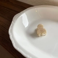Mini cream hair claw clip with France Handmade lettering in a white ceramic dish - Brown