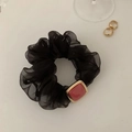 Detail of pink crystal on gold square ornament with black sheer mesh scrunchie - Cube