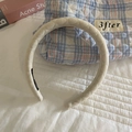 Quilted beige sponge headband with classic diamond lattice texture and high top style - Off-white