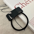Close-up of black acetate hair tie with golden France Handmade logo on resin plate - Hair Tie / Black