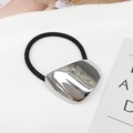 Elastic black hair tie featuring a silver polished irregular metal heart ornament - Silver