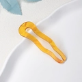U-shaped hair pin in bright orange tortoiseshell acetate with elegant wave design - Caramel color