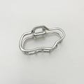 Close-up of silver wavy metal hair claw with geometric minimalist hollow design - Silver