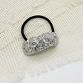 Detail of silver hammered metal buckle on black elastic hair tie on white fabric - Hammered Silver Texture Style (3 Pieces Silver)