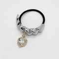 Detailed view of silver spiral metal hair tie with heart-shaped crystal pendant and stones - Twist Style (557-Silver)