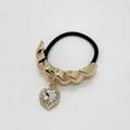 Detailed shot of golden twist metal hair ring with sparkling crystal heart charm - Twisted Style (557-Twisted Gold)