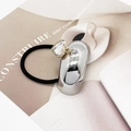 Macro detail of silver U-shaped metal hair tie with sparkling heart-shaped crystal charm - Curved Silver (555-A Model Silver)