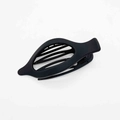 Close-up of matte black fish-shaped hair clip with multi-row inner teeth detail - Black