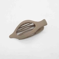 Detailed view of a matte brown hollow shuttle-shaped hair clip for women's hairstyles - Chestnut