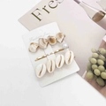 Detail view of 3-piece shell and pearl hair clip set on a minimalist fashion display card - Scallop Pearl and Cowrie Style