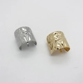 Close-up of gold and silver ponytail hooks with irregular hammered metal texture details - Style A Gold And Silver Set