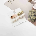 Detailed view of starfish and seashell hair pins on a decorative card for styling - Gold and Mixed Color Shell Style