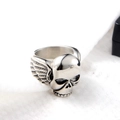 Macro side view of hip hop punk ring featuring skull and wing details on silver metal - US 12 / Wing Skull Ring