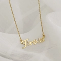 Elegant gold Forever letter pendant necklace for women with zircon inlay on white tulle - Gold