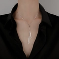 Minimalist S925 silver necklace with double geometric triangle pendants on a black shirt - Silver