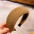 Brown knitted wide headband with rib texture design for an autumn winter hairstyle - Turmeric