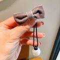 Elegant velvet bow hair tie in dusty purple with a large white pearl drop pendant - Dusty Pink