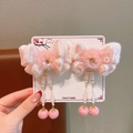 Detail of pink butterfly hair clips with floral accents, plush trim, and long tassels - Pink Embroidered Butterfly Pair Style / Pink Butterfly