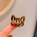 Mini acetaat vlinder haarklem in donker schildpadpatroon met een gouden metalen veer - 3-Schildpad