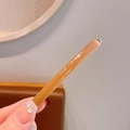 Handmade amber marble resin hair stick with a smooth polished finish and round bead - Brown