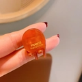 Amber acetate hair claw clip for bangs with handmade gold lettering and glossy finish - Brown