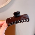 Glossy dark brown large acrylic claw clip for hair styling held in hand - Dark Coffee