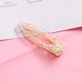 Close-up of glitter foil hair clip with clear resin and gold alloy base detail - Waterdrop-Silver