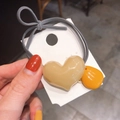 Grey elastic hair tie featuring a beige 3D heart and yellow water drop pendant - Beige